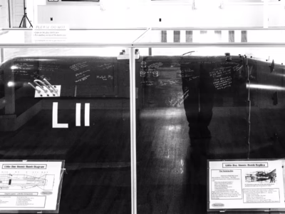 A close-up of the same bomb, where you can see the the signatures of Paul Tibbets and other crew members of the Hiroshima mission (the crew visited in 2004). You can see Tibbets' signature center right, written large--the same location Tibbets signed the original Little Boy. In addition, according to John Coster-Mullen, who made the replica along with his son, Jason, the three remaining crew members of the Enola Gay also signed (he does not name them) as well as the widows of Ferebee, Beser, Downey, and the nephew of Fred Olivi, along with others. The replica was signed at the 509th reunion in Wichita, Kansas in 2004.