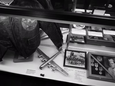 A display case honoring Ralph D. Belanger, the assistant flight engineer on the The Great Artiste, a B-29 that accompanied Bockscar to Nagasaki. Belenger was actually part of the crew of Bockscar but he, along with his captain Frederick C. Bock and the entire crew, traded places with the The Great Artiste crew due to instrumentation issues. Thus, instead of the The Great Artiste dropping Fat Man, it was dropped by Bockscar. Belanger can be seen in the portrait in the center of the group image, with his crew.