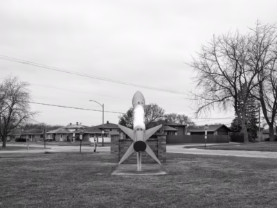 Not many homes come with a view of a nuclear weapon. These homes in Crestwood, Illinois are among the lucky few. The Honest John is positioned at the corner of a sizable municipal park.