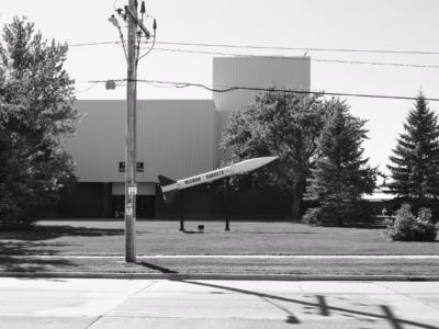 The Honest John is an uncommonly popular weapon display, often at non-military locations. This Honest John, at a middle school, has been there so long none of the school staff, save a guard I met with a special interest in atomic weapons, seems to know that it is a nuclear rocket. Located in Neenah, Wisconsin.