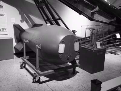 The Mark V bomb, as you can see, has door panels that can be opened to facilitate the removal of the nuclear "pit" (to either safeguard the weapon from a nuclear explosion or to allow the use of pits with various degrees of explosive power). The part that goes in and out of the weapon with the pit is called the "birdcage" and the insertion process could be automated. An example of a birdcage is sitting right there in the clear case next to the bomb.