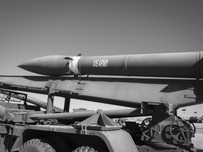 The middle section of the Honest John held the propellant, which apparently operated best at 77 degrees Fahrenheit. To help achieve this a warming blanket was placed over the rocket when being transported. It is entirely unclear how the rocket would be cooled if the Sun warmed it above 77 degrees, or what the actual thermal operating range of the rocket might be if it could not be held at the proper temperature. This unit baking in the heat at the Yuma Proving Ground, Arizona.