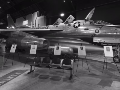 The plane behind the B53 bomb is the B-58 Hustler fighter-bomber. One of the most interesting features of the Huster was that a special pod was designed for it that could hold fuel and a nuclear bomb, such as the B53. In use the Huslter had the ability to fly at just a few hundred feet above ground and to drop the bomb, which would then open a series of parachutes to slow the bomb's speed, before coming to a stop on the ground. The bomb would then detonate after a timed delay. This unit is located at the National Museum of the US Air Force, in Dayton, Ohio.